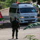 Earlier today, an ambulance with flashing lights leaves the cave rescue area in Mae Sai, Chiang Rai province, northern Thailand.
